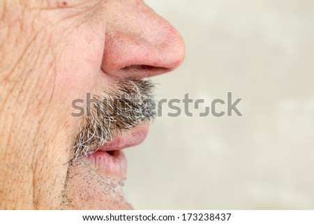 man showing his mouth and whiskers