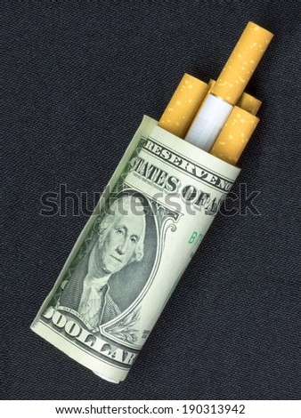 No smoking. The concept - expensive habit. Cigarettes and money on a background.