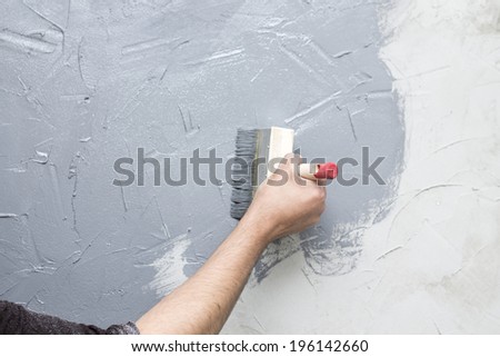 man doing finishing repairs