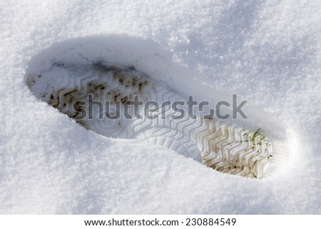 Closeup of footsteps in snow going forward