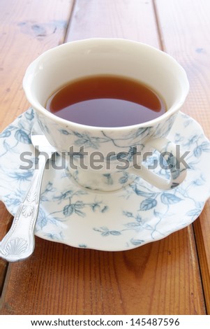 English tea without milk in a fine china cup with saucer