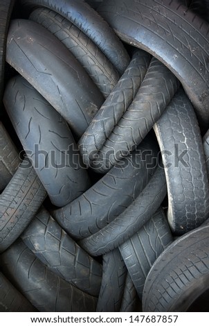 Pile of old worn out tires in a re-cycling area