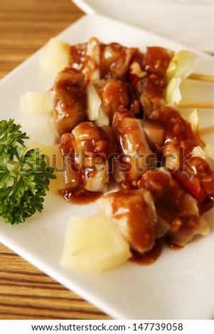 Yakitori, grilled chicken and pineapple, a Japanese type of skewered chicken