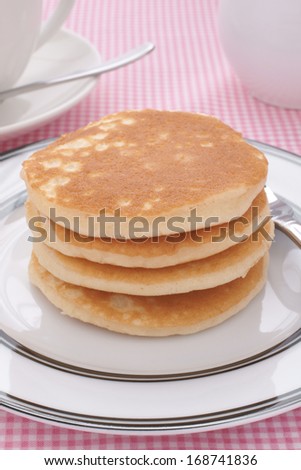 Stack of plain buttermilk pancakes no butter or syrup