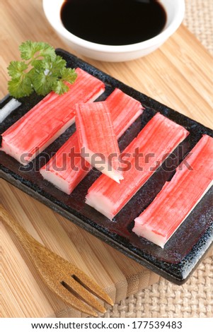 Surimi sticks a form of kamaboko, a processed seafood made of white fish flesh selective focus on top stick