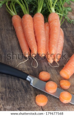 Cutting up freshly picked carrots