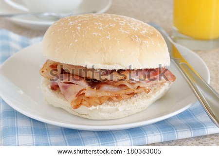 Bacon roll or bacon sandwich selective focus on the bacon