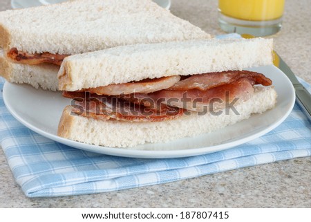 Freshly made bacon sandwich on white bread