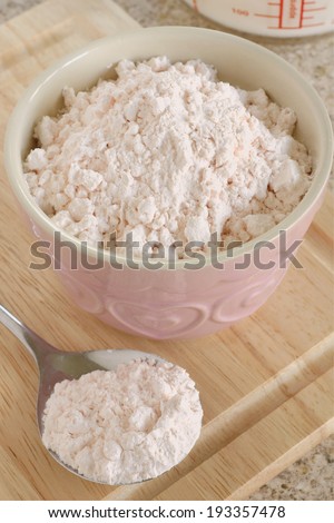 Custard Powder a cornflour based powder which when mixed with hot milk produces an egg free custard sauce