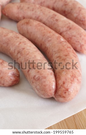 Traditional British pork sausages selective focus on front sausages