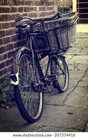 Vintage delivery bicycle with vintage filter applied to the image