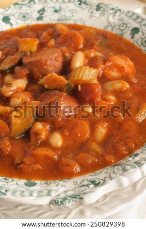 Tuscan bean soup made with cannellini beans courgette and Italian sausage