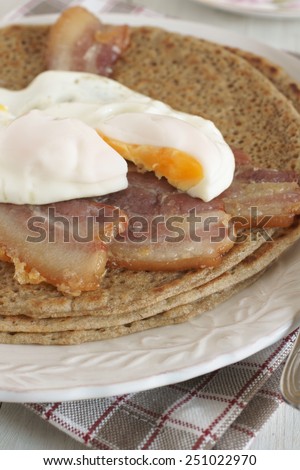 Staffordshire Oatcakes a savoury pancake with bacon and egg