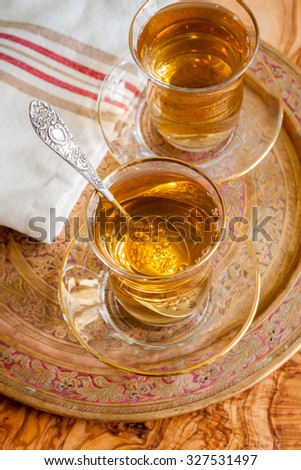 Turkish apple tea an apple flavoured beverage served in Turkish tea glasses