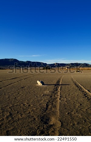 Dry salt lake - desert landscape, trace of tires detail - global warming, climate change
