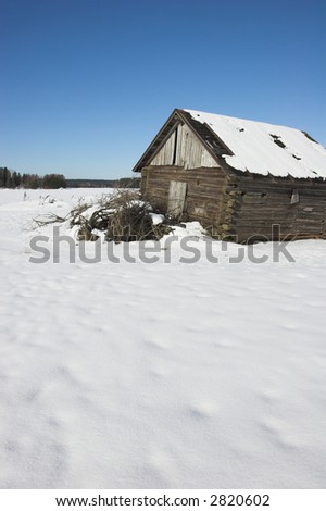 Very old barn. Sunny winter day.