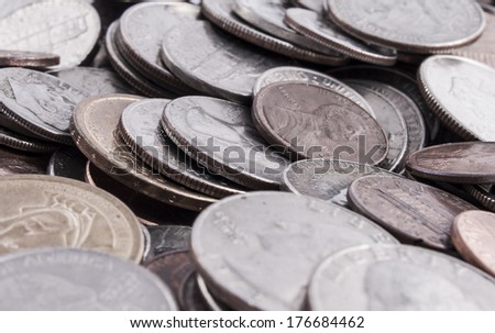 Pile of U.S. coin, nickels.dimes,quarters,pennies, and dollar coins