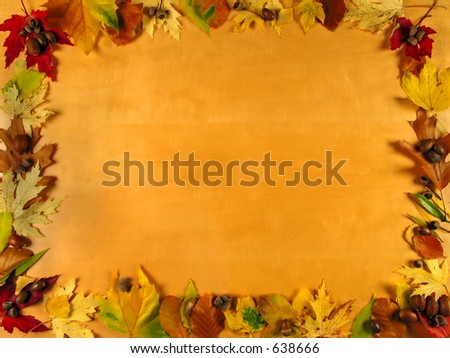 Beautiful frame of autumn leafs on wood background, very warm