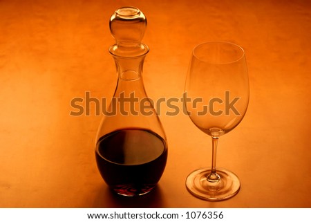 view of a glas and wine on a wooden table, very warm feeling