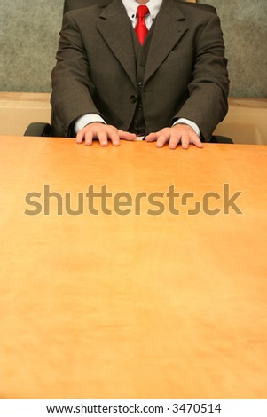Business-man waiting at the desk, open hands on the desk.