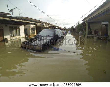 KUANTAN, PAHANG, MALAYSIA-DEC 05, 2014:Unidentified of condition submerged vehicle after struck the worst floods in history