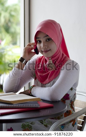  Coffee Shop on With Stylish Head Scarf Smiling And Make A Phone Call At Coffee Shop
