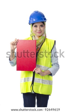 Beautiful muslim woman with personal protective equipment holding red note book