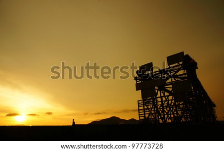 silhouette of jacket leg isolated over golden sunset