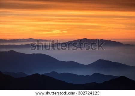 Bight and colorful high mountain landscape in haze. Captured at the high mountain pass in Himalayas.