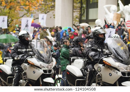 PORTLAND, OREGON - NOV 17: Motorcycle Police Watching over protesters in Downtown Portland, Oregon during a Occupy Portland protest on the first anniversary of Occupy Wall Street November 17, 2011