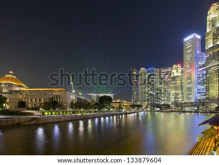 Singapore Central Business District (CBD) City Skyline by Boat Quay Along Singapore River at Night with Laser Light Show