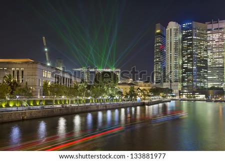 Singapore Central Business District (CBD) City Skyline by Boat Quay Along Singapore River with Laser Light Show at Night