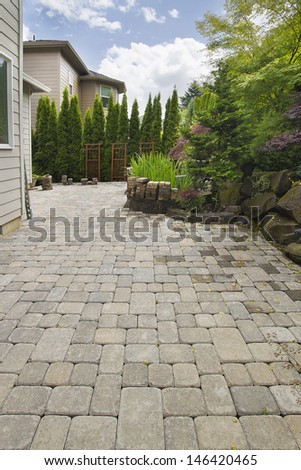 Garden Backyard Hardscape Brick Pavers Patio With Pond Trees Natural Rocks Landscaping