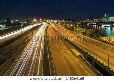 Interstate Freeway Light Trails Through Portland Oregon City Along Willamette River at Night