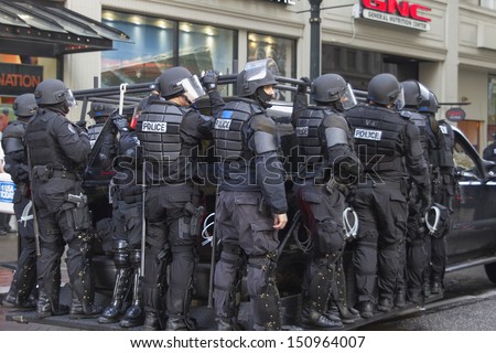 PORTLAND, OREGON - NOV 17: Police in Riot Gear on SUV in Downtown Portland, Oregon during a Occupy Portland protest on the first anniversary of Occupy Wall Street November 17, 2011