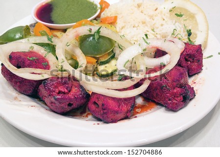 East Indian Lamb Kebab with Basmati Rice Vegetable Lemon and Tamarind Chutney Sauce Closeup