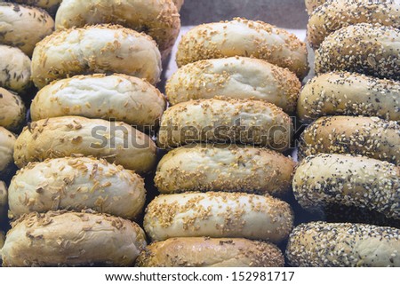 Variety of Bagels with Grains and Seeds at Bakery Shop Closeup