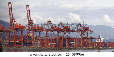 Port of Vancouver BC Canada with Red Cranes and Shipping Containers at Shipyard Panorama