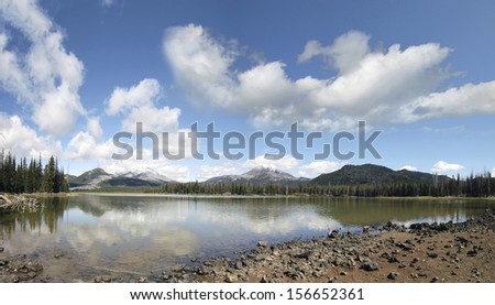 Sparks Lake in Deschutes National Forest Oregon with Mountains Blue Sky Clouds and Water Reflection