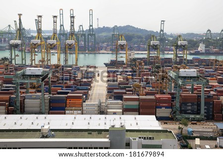 SINGAPORE, SINGAPORE -FEB 12, 2014: Port of Singapore with Container Ships Loading and Unloading Containers at shipyard. Singapore is the second busiest port in the world in terms of tonnage.