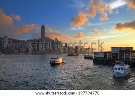 Hong Kong Island Central City Skyline from Kowloon Ferry Pier Along Victoria Harbor Sunset