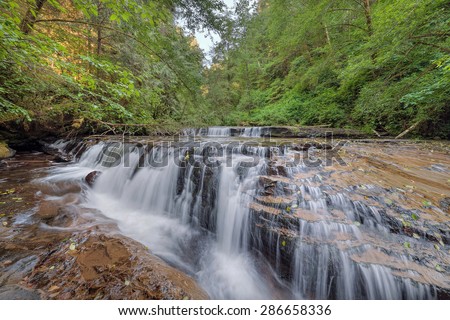 Tiered Cascading Waterfall Over Wide Ledge at Sweet Creek Falls Trail Complex in Mapleton Oregon