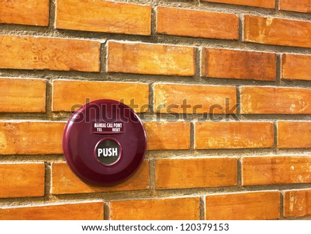 fire alarm on brick wall