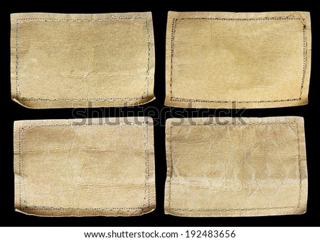 collection of various jeans labels on black background