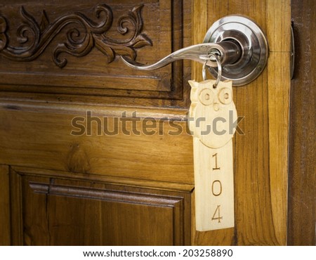 A key in a lock with house