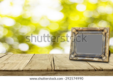 picture frame on wooden floor and bokeh for background texture.
