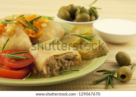 stuffed cabbage with olives   in ceramic plate