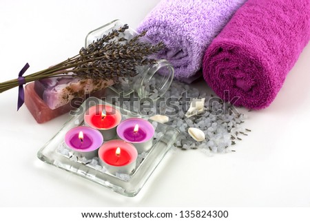 spa still life with bath towels and natural soap and salt crystals