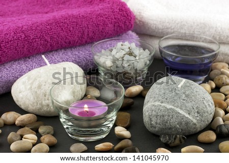 spa still life with bath towels, candles and salt crystals