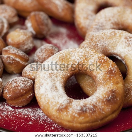 sweet donuts on a red plate